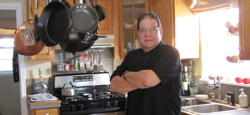 Photo of Earl Haddad in a kitchen.